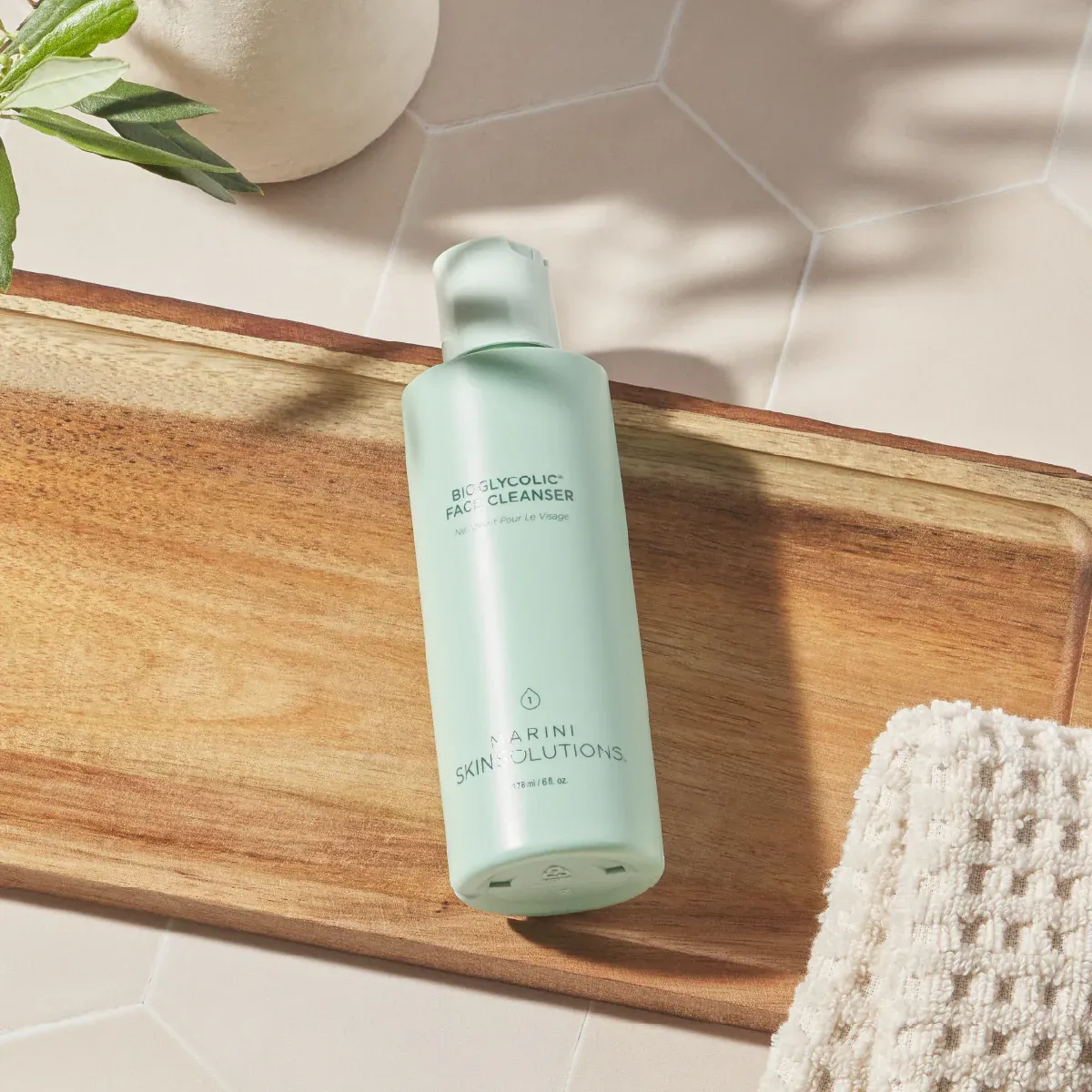 Green bottle on bathroom tray