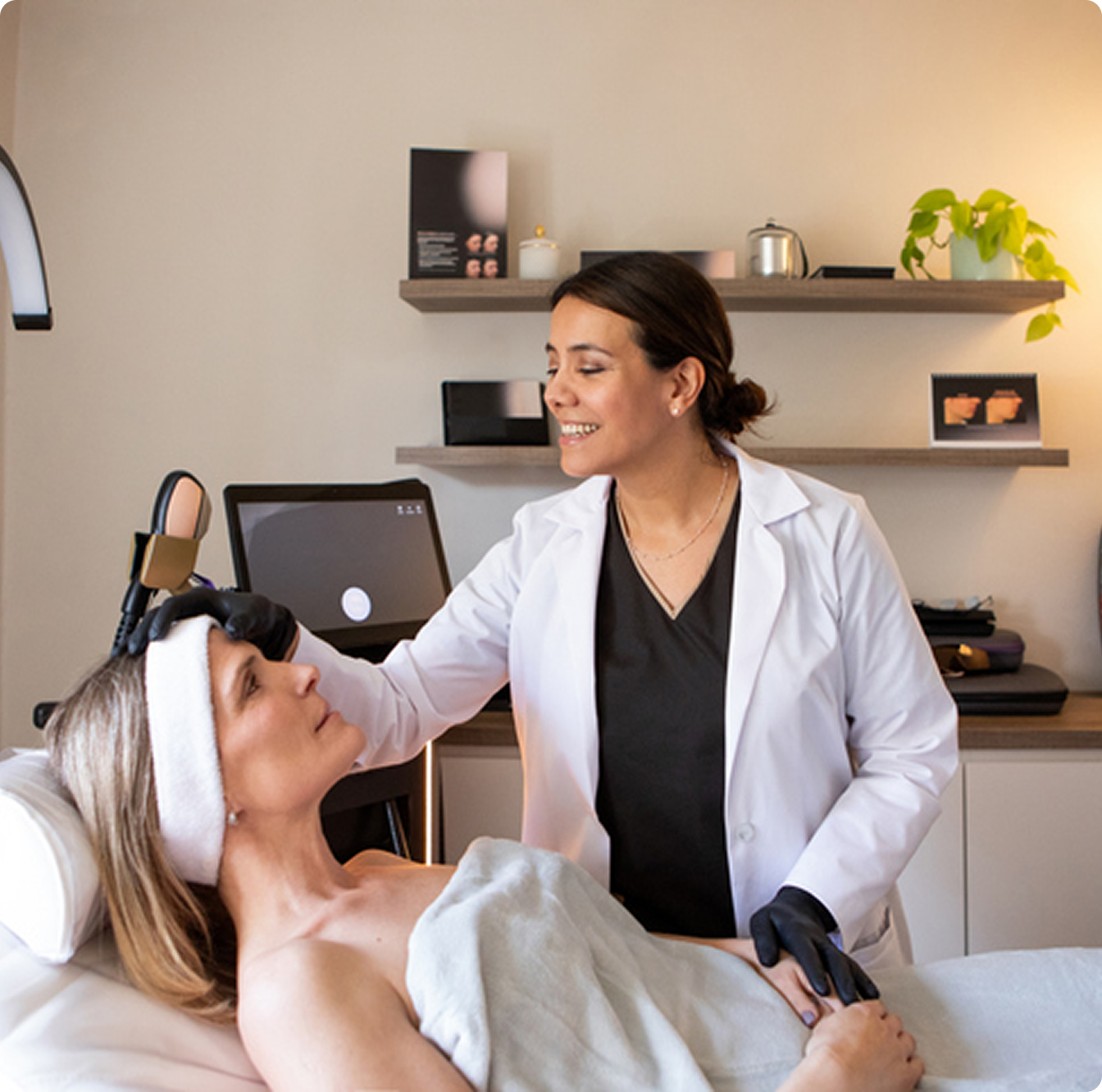 Aesthetician performing skincare procedure on client
