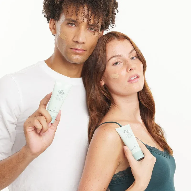 Diverse models showcasing skincare tubes