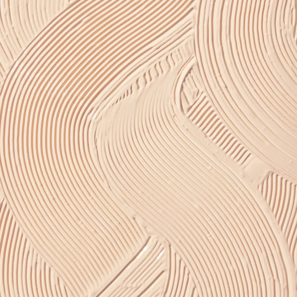 Textured cream surface with swirling patterns