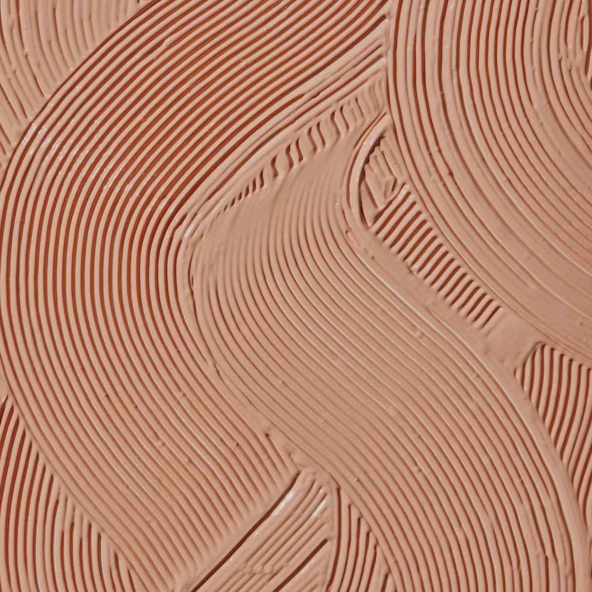 Abstract design in light brown clay