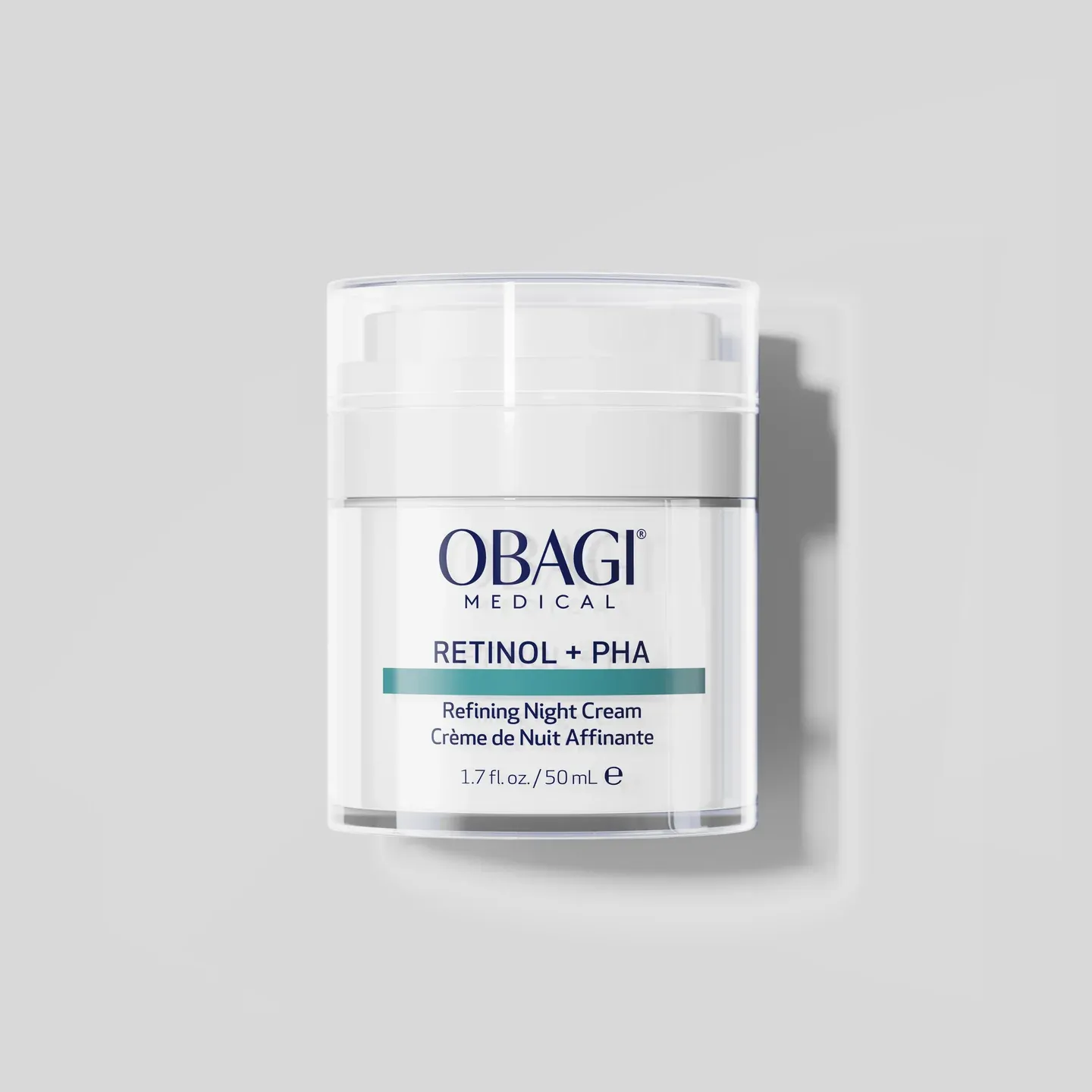 Skincare night cream container on gray background.
