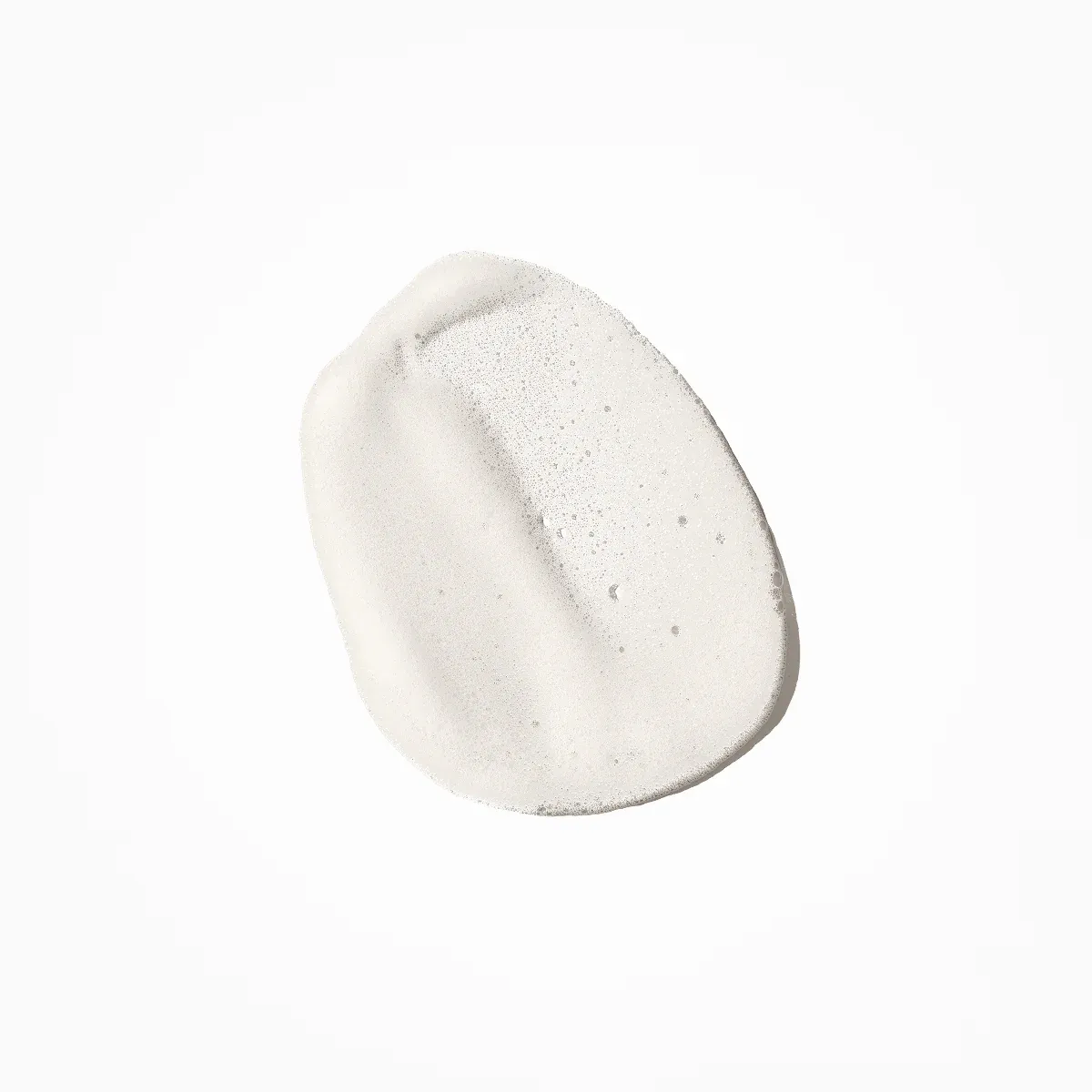 Skincare cream swatch on white background